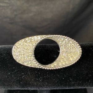 Vintage silver tone oval brooch with clear stones